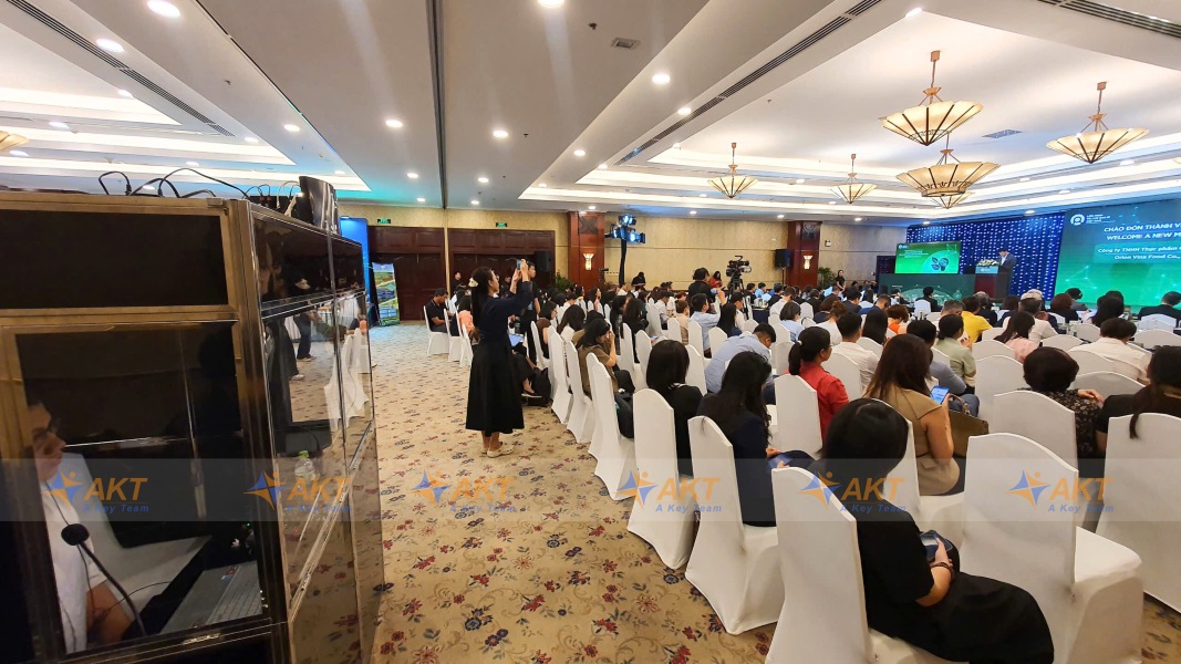 AKT simultaneous interpreters working inside interpreting booth at PRO Vietnam conference